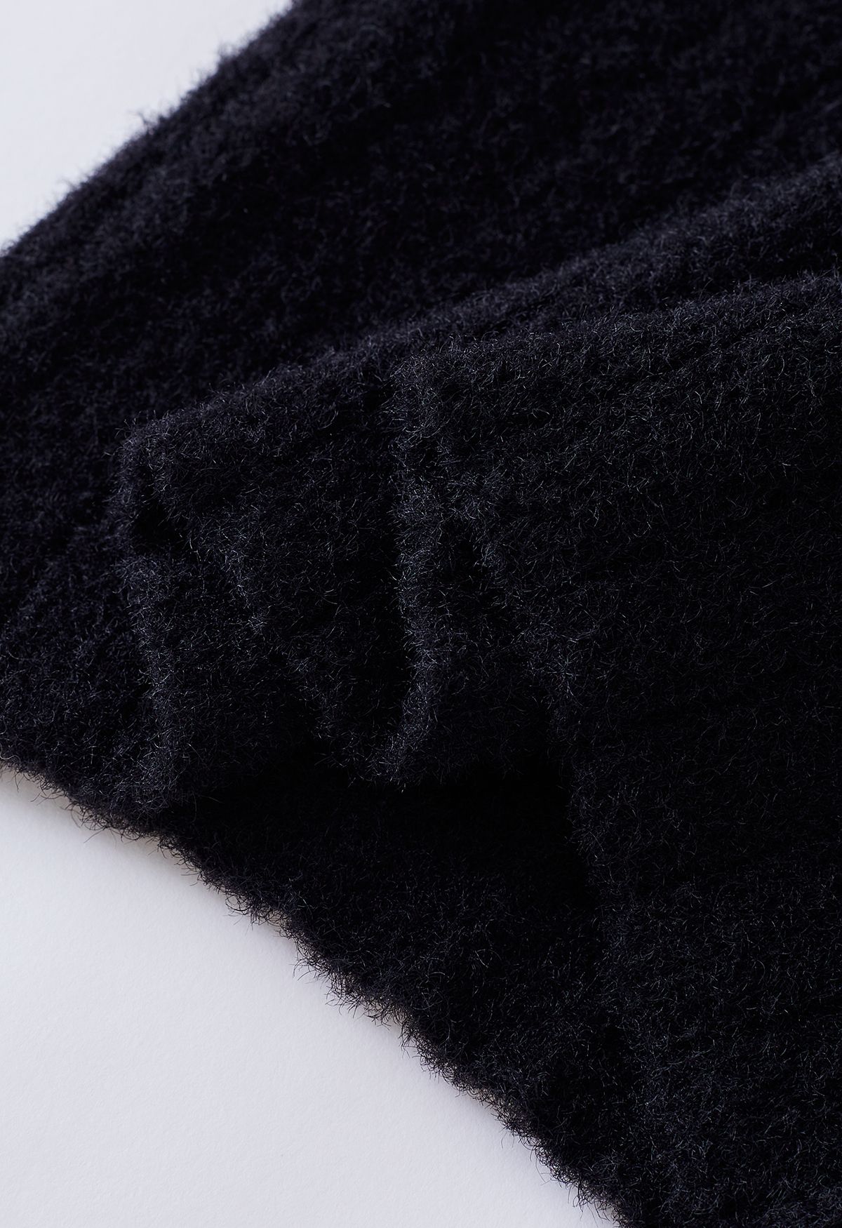 Cold-Shoulder Twist Cutout Crop Knit Top in Black