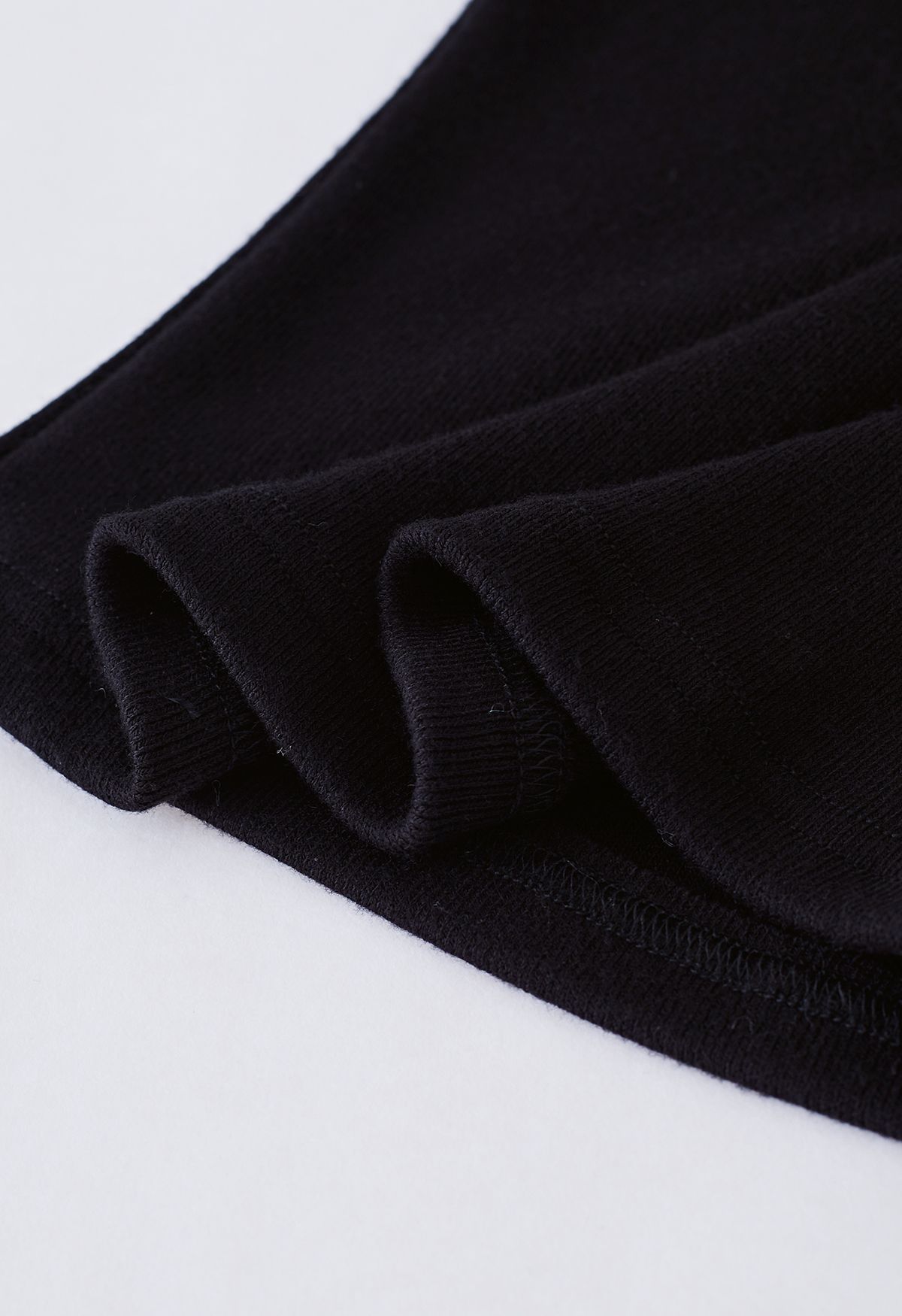 Light Feather Off-Shoulder Knit Crop Top in Black