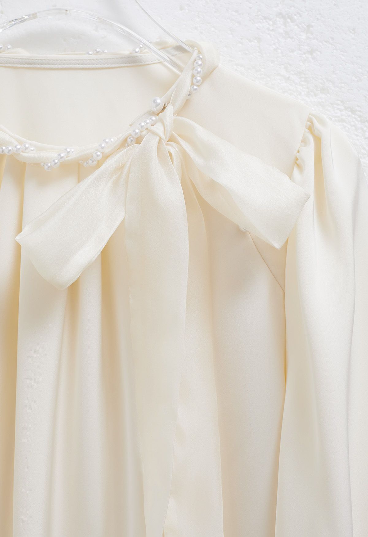 Pearly Neckline Side Bowknot Satin Top in Cream