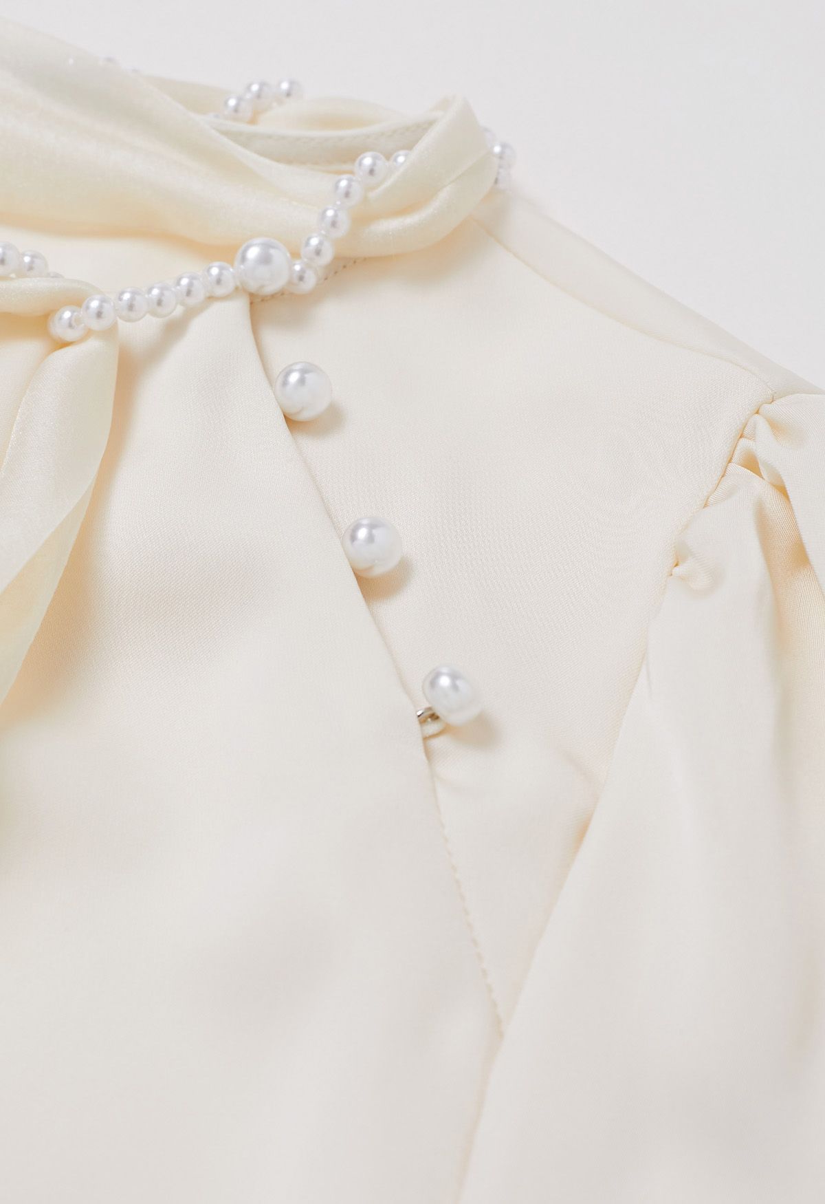 Pearly Neckline Side Bowknot Satin Top in Cream