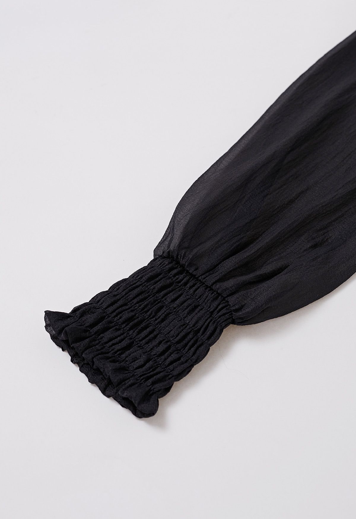 Self-Tie Side Bowknot Sheer Top in Black
