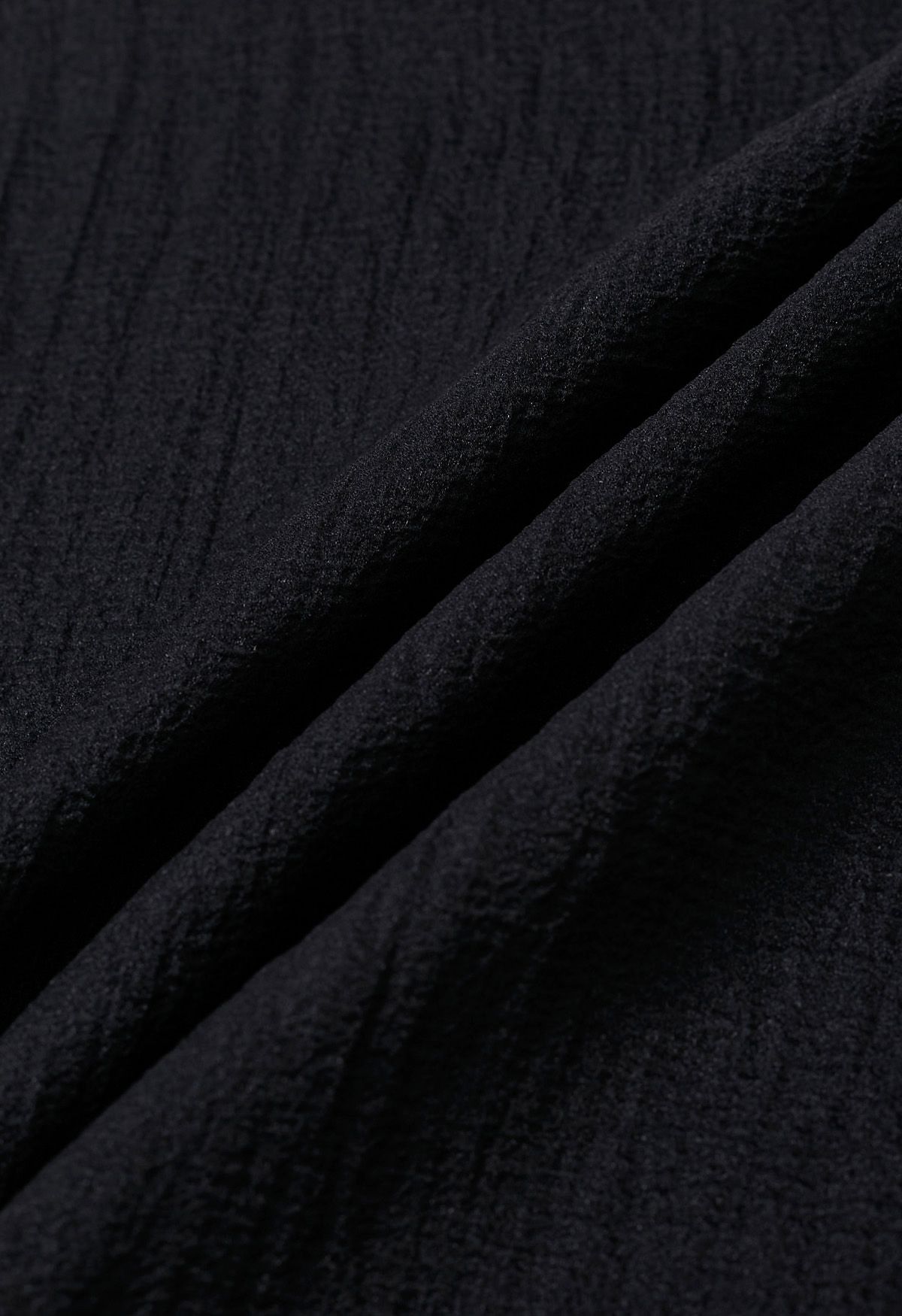 Self-Tie Side Bowknot Sheer Top in Black