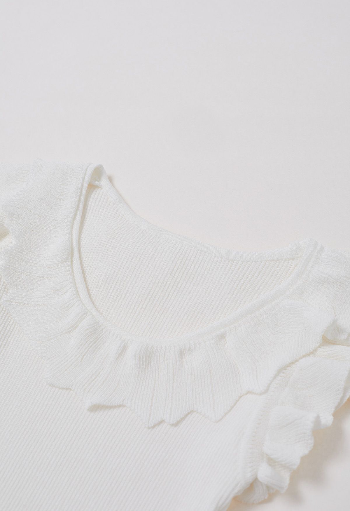 Ethereal Ruffle Sleeveless Knit Top in White