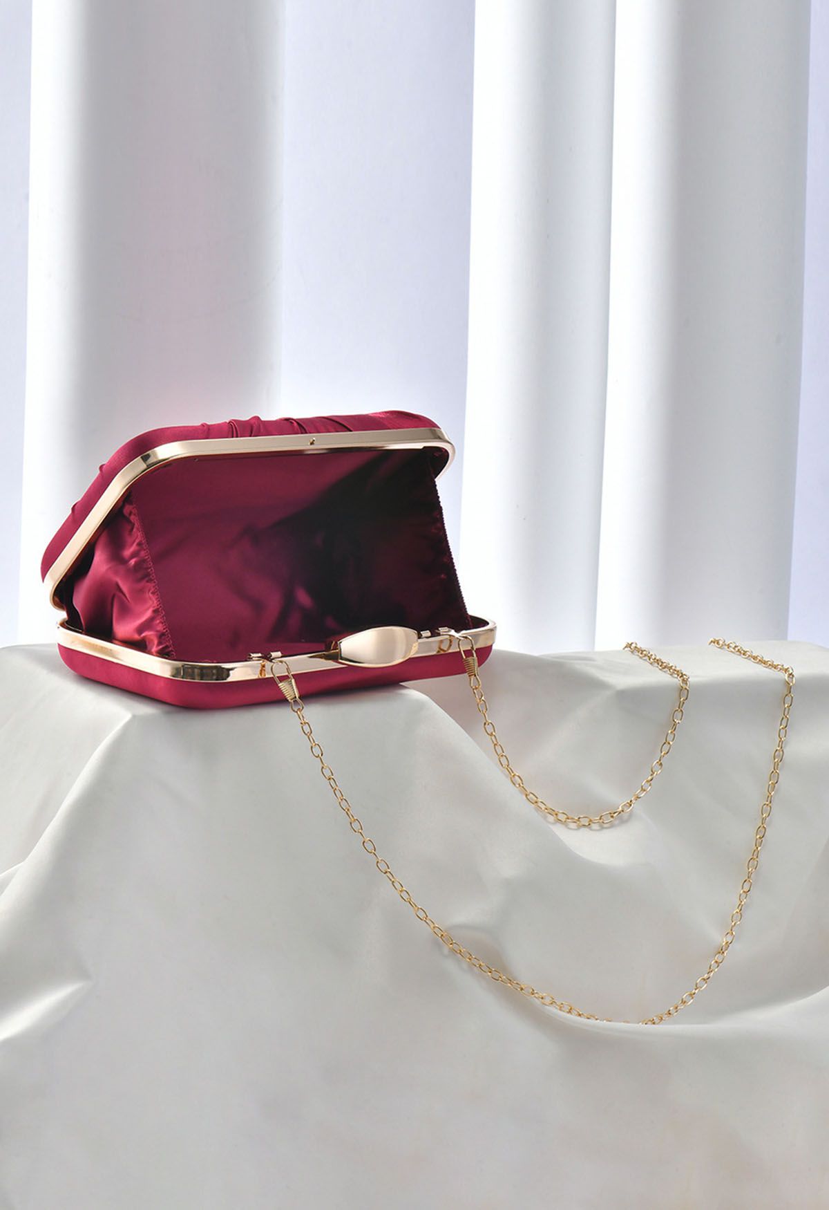 Ruched Knotted Satin Clutch in Burgundy