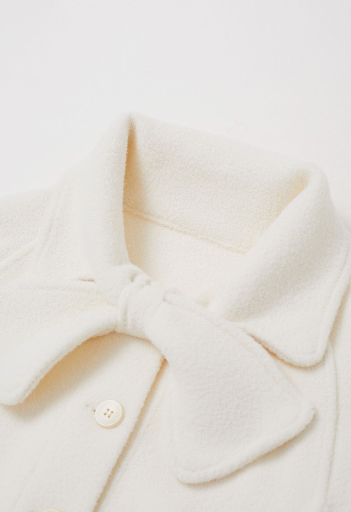 Bowknot Decor Faux Fur Pocket Buttoned Knit Cape Coat in Cream