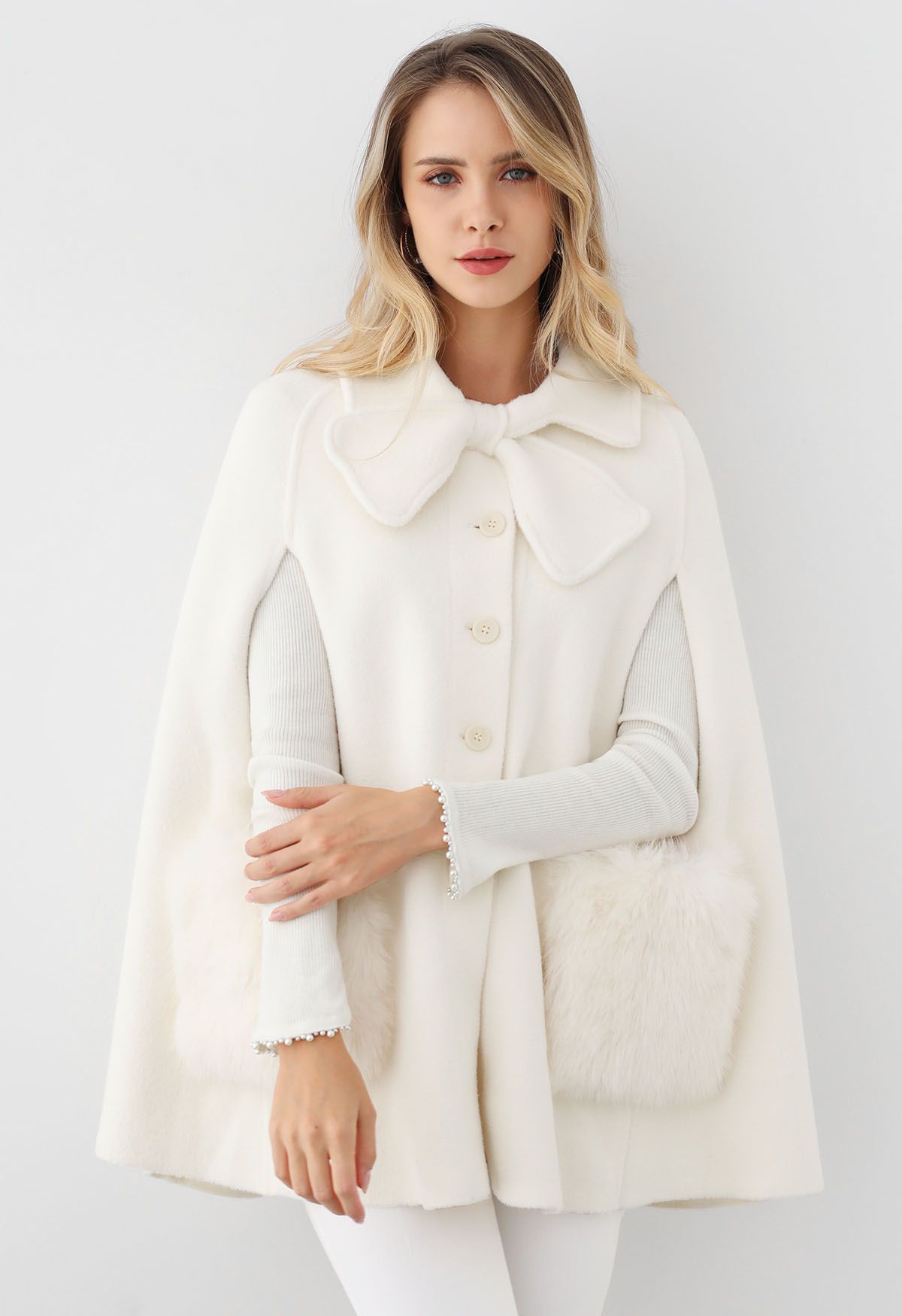 Bowknot Decor Faux Fur Pocket Buttoned Knit Cape Coat in Cream