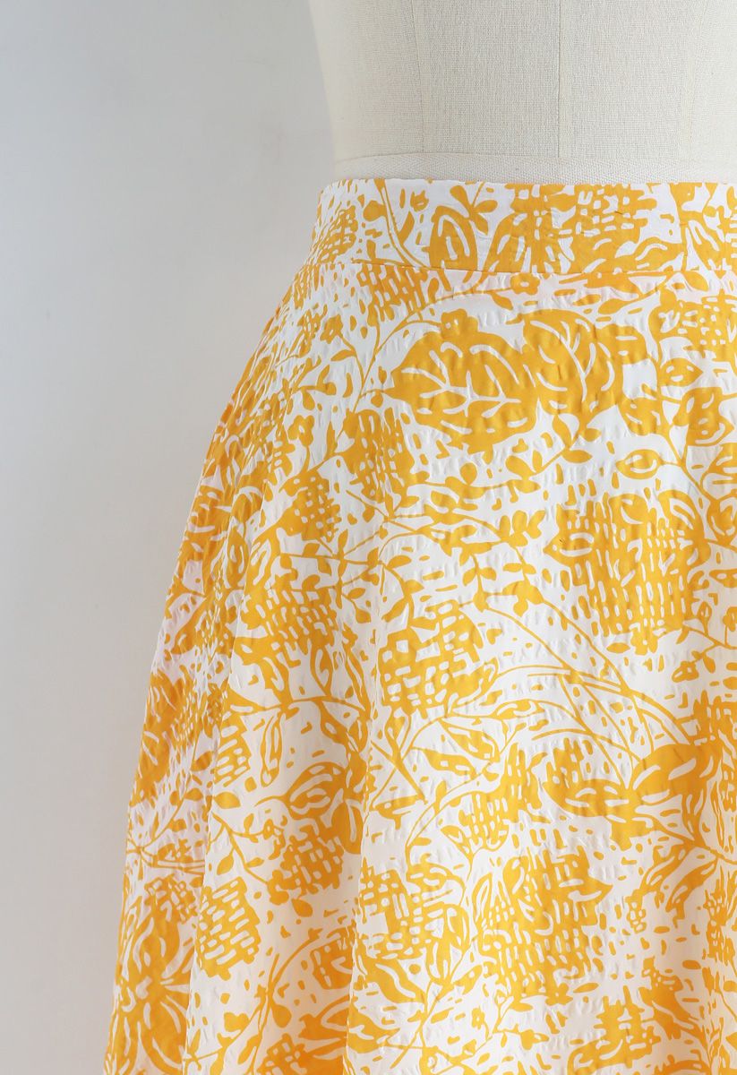 想像一下黃色的花朵壓紋A字裙