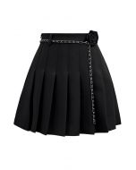 Rose Brooch Chain Belt Pleats Mini Skirt in Black